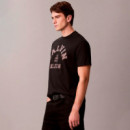 Camiseta holgada universitaria con logo gráfico